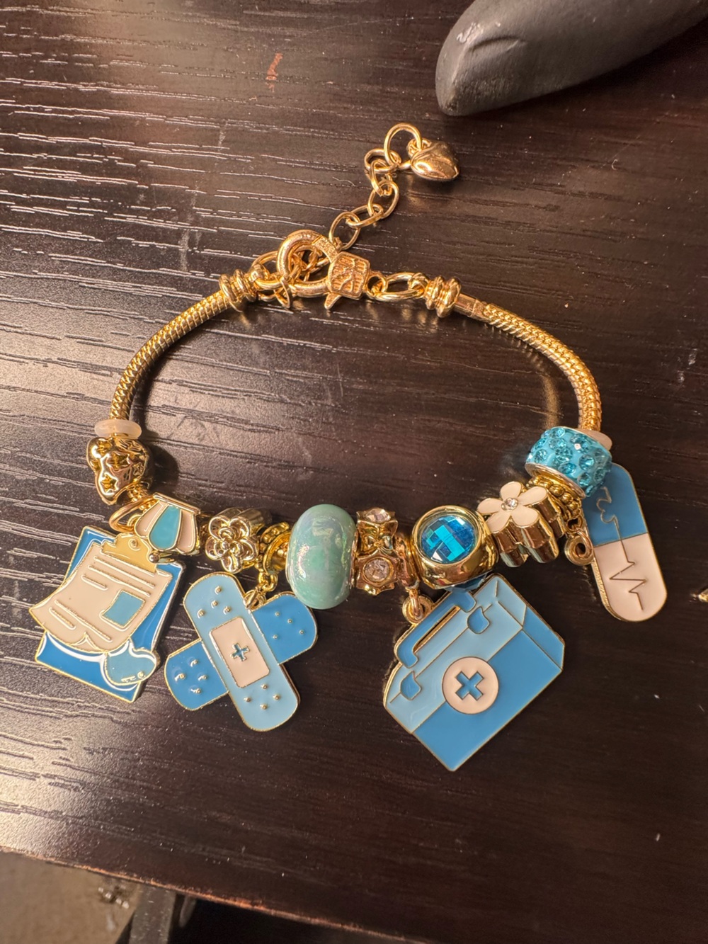Gold-Tone Medical Charm Bracelet with Light Blue Enamel Charms
